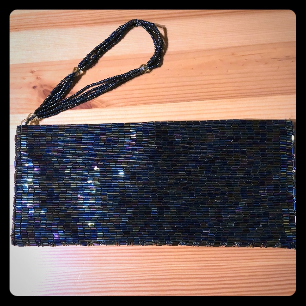Bebe iridescent beaded wristlet magnetic clutch